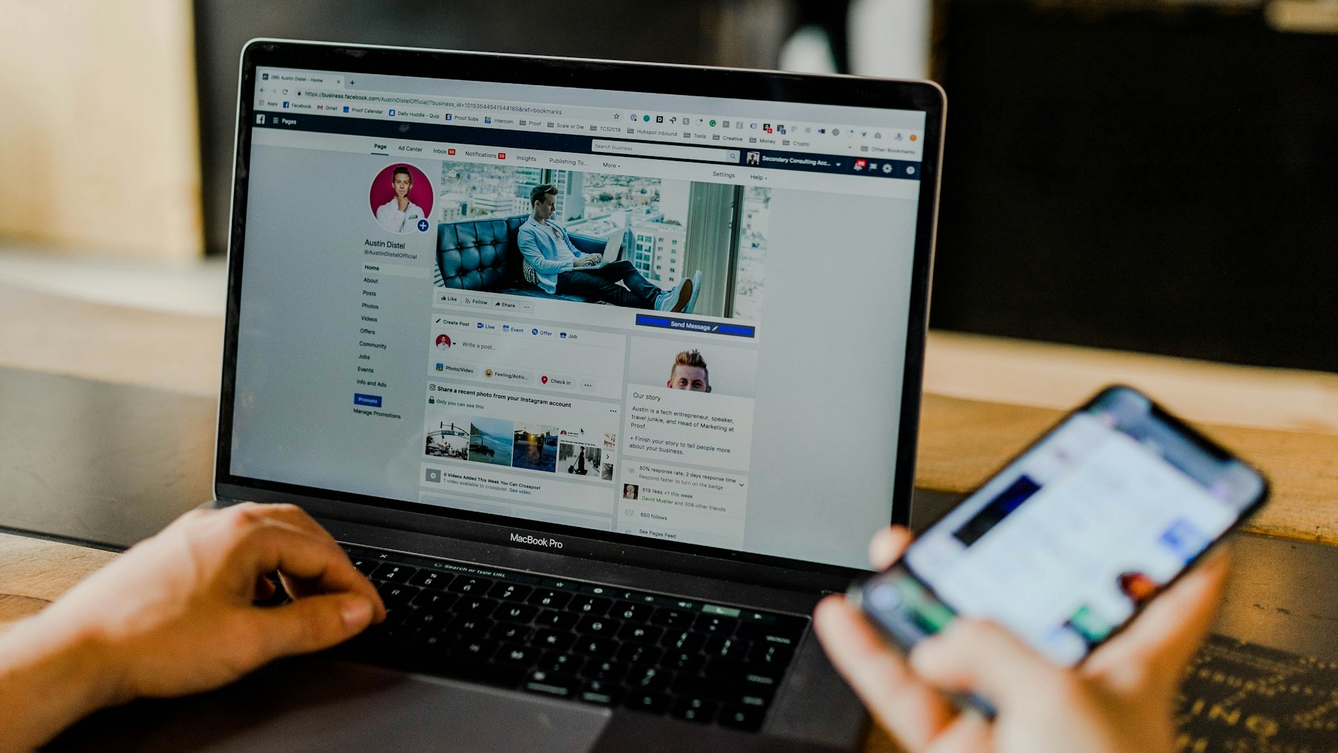 Person using both a smartphone with Instagram and a laptop with a business website simultaneously